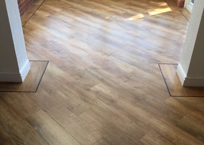 Karndean Van Gogh wood-effect floor with a dark picture-frame border