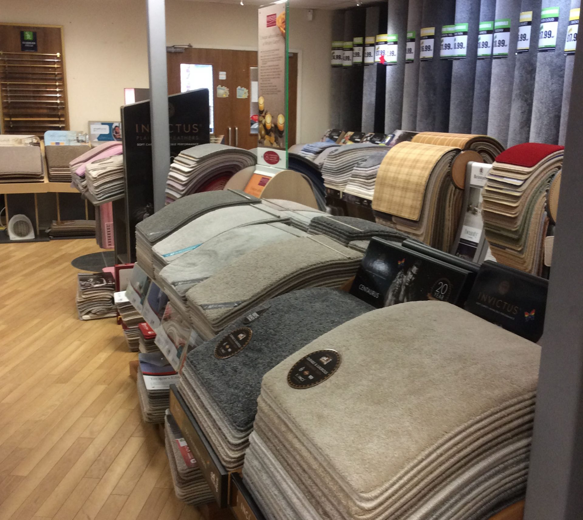 Carpet sample books and standing rolls in the Leyland showroom