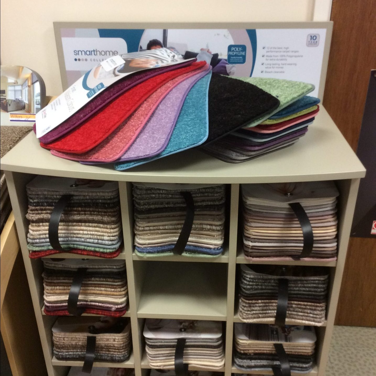 Smarthome collection carpet swatches fanned on a wooden stand